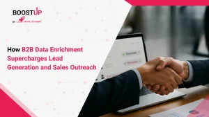 Two business professionals shaking hands in front of a laptop displaying enriched sales data, illustrating the benefits of B2B data enrichment for lead generation and sales outreach.